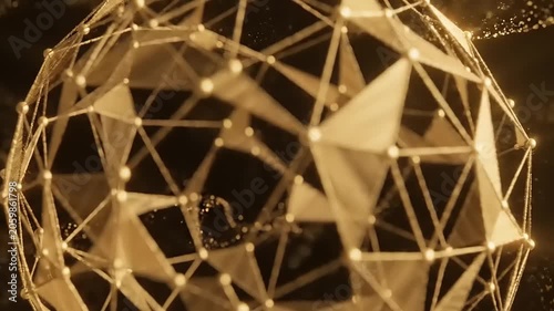 Golden geometric sphere with triangular faces and glowing connections rotating in darkness