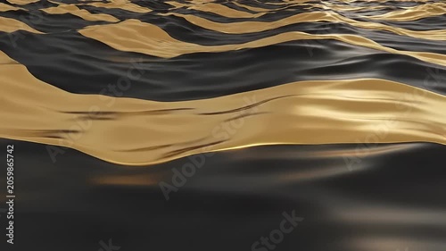 Golden light reflects on rippling dark water surface