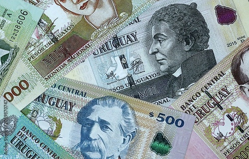 Bild auf Leinwand Uruguayan peso money bills in pile