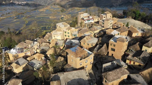 China rural construction and changing villages - drone shot of new (and old) houses with classic design in Yuanyang region