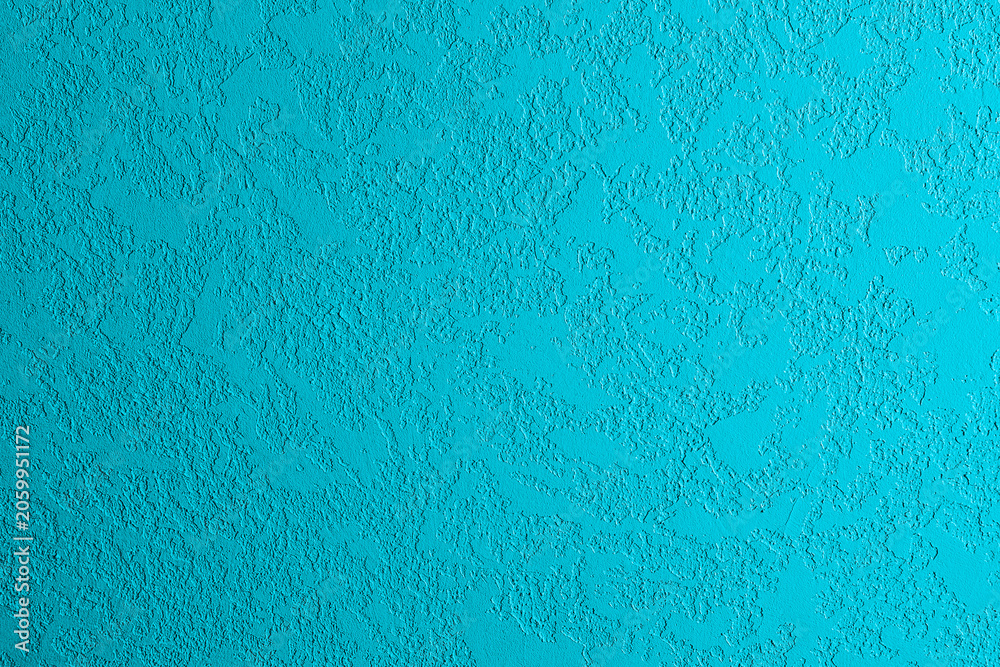 Obraz premium Blue textured surface with rough stucco finish