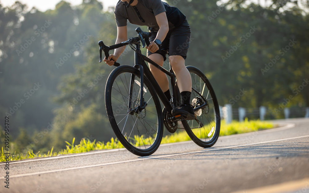 Naklejka premium People cycling on the greenway