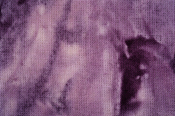 Macro view of purple tie dye fabric texture