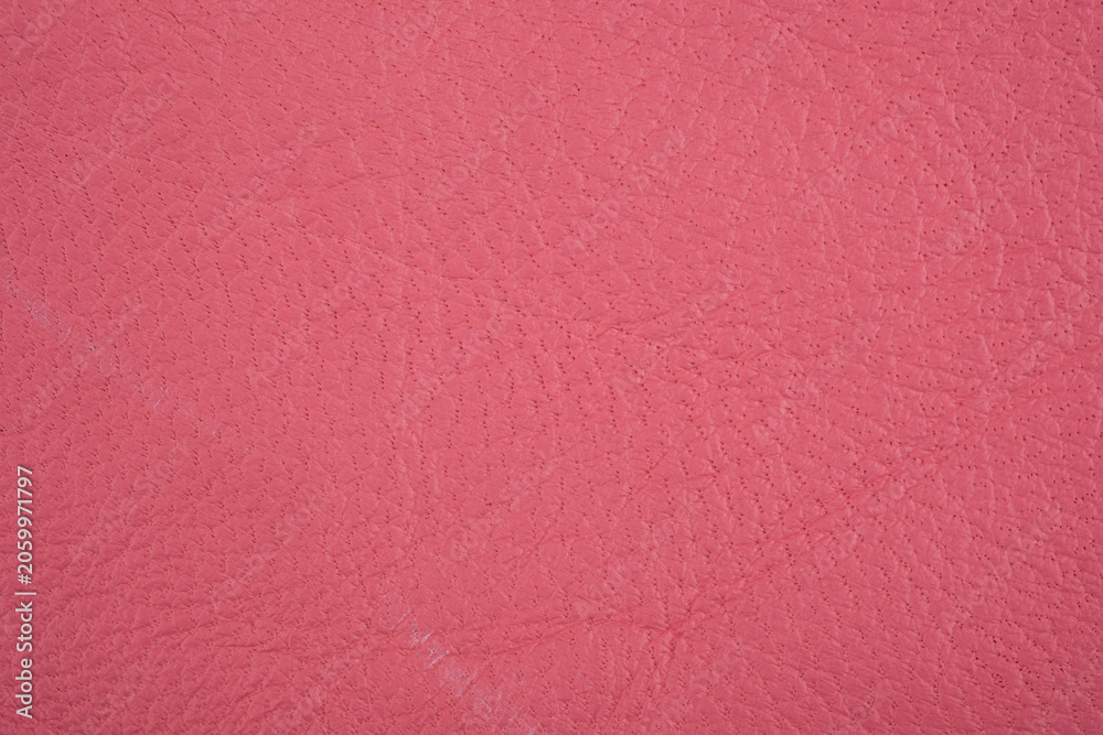 Fototapeta premium Pink leather material with subtle texture and grain detail