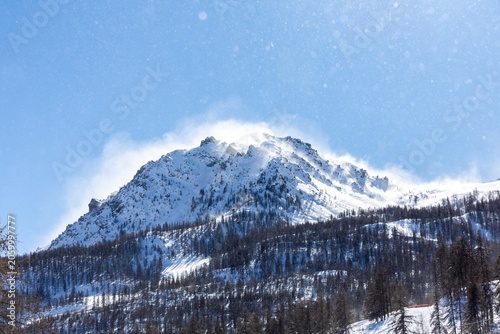 Snow-capped mountain peak with clear blue sky
