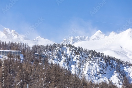 Winter landscape with snowy mountains and trees