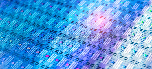 High-tech Macro Photography of a Colorful Silicon Wafer with Microchip Patterns for AI Hardware and Semiconductor Industry Concept.