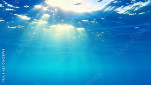 Sunlight filtering through clear ocean water, creating a serene underwater atmosphere. Ideal for relaxation and nature-themed projects