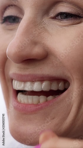 woman inserting transparent invisible dental aligners for teeth straightening, dental night guard