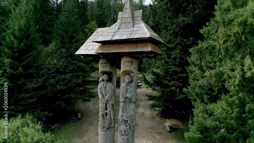Tableau sur toile Detailed drone shot of traditional Hutsul wooden gatehouse with intricately
