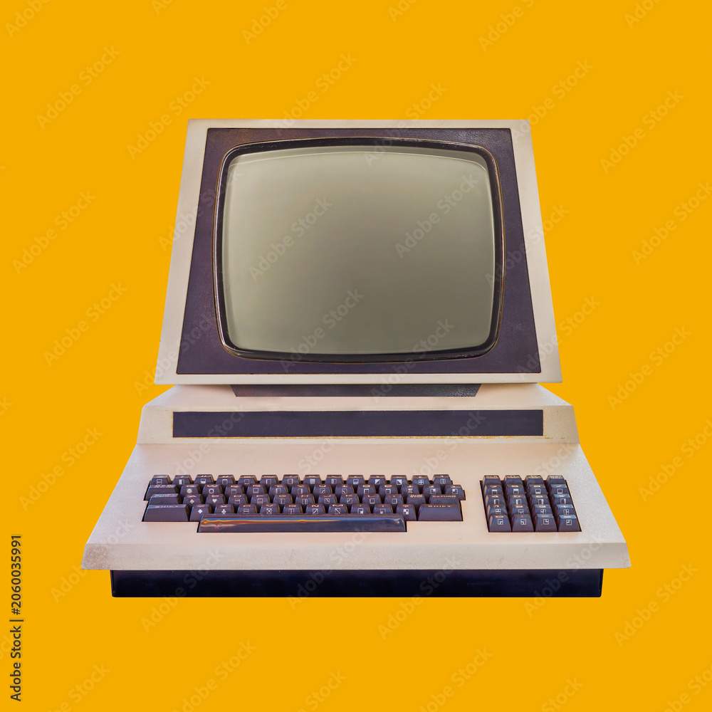 Fototapeta premium Vintage eighties desktop personal computer with crt display on an orange background