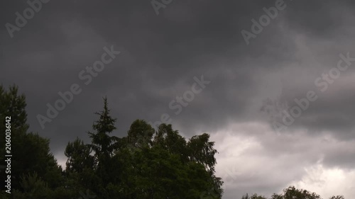 Dark Storm Clouds Gathering Over Tree Tops 4K Video Dramatic Weather Approaching Natural Atmosphere
