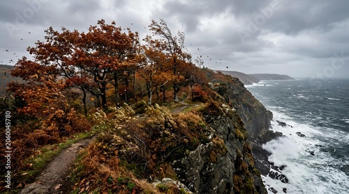 Rugged Coastal Cliff Landscape Featuring Vibrant Autumn Foliage and Dramatic Stormy Skies Over the Turbulent North Atlantic Ocean