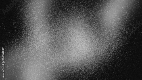 Abstract grainy gradient background with frosted glass texture, dark monochrome black and white blurred noise backdrop for posters and web design.