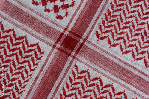 Photos Traditional red and white Arabic folded shemagh fabric background