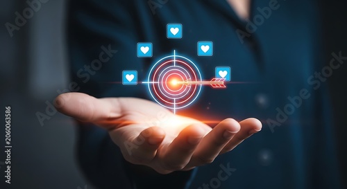 Hand holding digital target with heart and arrow palm