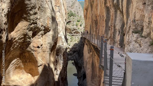 Drone view of the Caminito del Rey walkway attached to towering canyon walls above the river below in Gaitanes Gorge, Málaga, Spain