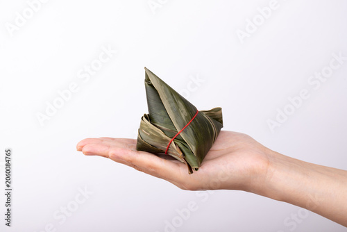 Holding a fresh zongzi in hand