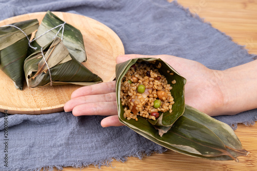 Preparing food for the Dragon Boat Festival - salted pork-filled zongzi