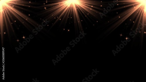 Decorative stage light rays with sparkles on plain black background