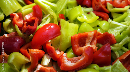 a mix of cut raw fresh red and green bell peppers