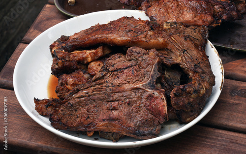 cooked beef steaks on the plate, serving
