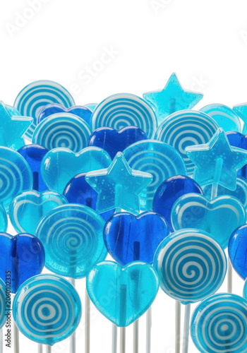 hyper-glossy electric blue lollipops and hard candies in various shapes, tightly grouped with fine sugar details, macro studio shot against a transparent background. concept for confectionery