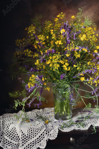 Still life. A photograph of a bouquet of wildflowers on a table.
