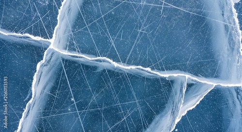 Cracked blue ice surface with scratches and grooves