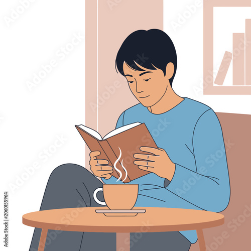 Young man reading a book while enjoying a hot drink in a cozy indoor setting