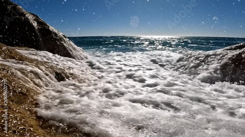 Dynamic Ocean Waves Crashing with Sunlight and Spray