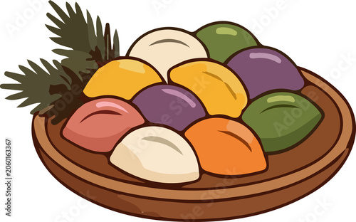 Korean rice cakes (songpyeon) beautifully arranged on wooden plates and platters with vibrant, assorted colors