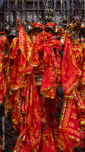 Maa Kamakhya temple sacred bells where chunris and devotional cloths are tied as offerings with slokas of Goddess Kamakhya written on it