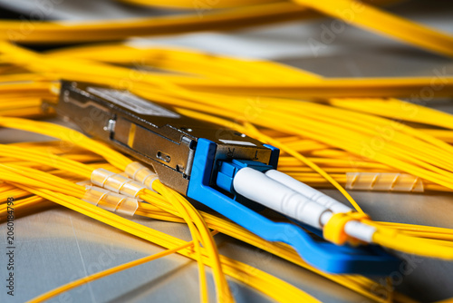 Gigabit Interface Converter, transceiver module connected to a fiber optic patch cord, telecommunications network components used in optical data transmission systems and IT infrastructure