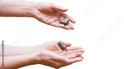 Halftone illustration of hands holding heart shaped stones on white background