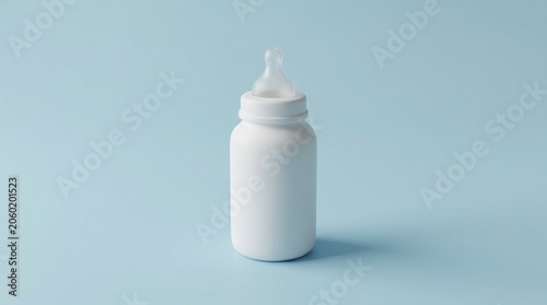 A minimalist blank white baby feeding bottle with a clear silicone nipple standing against a solid light blue background