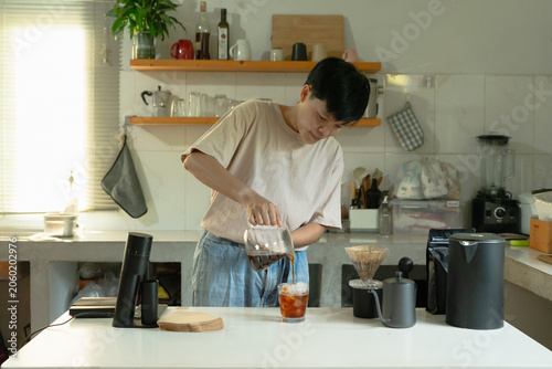 фотографія Asian preparation Pour drip coffee a healthy caffeinated beverage enjoyed in the home kitchen in the morning