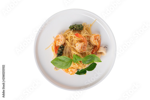 Spicy seafood spaghetti top view, Thai food isolated white background.
