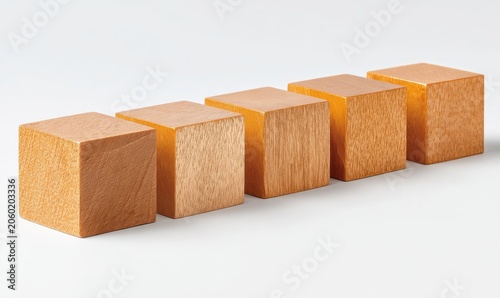 Five Golden Metallic Cubes Arranged In A Row On A Plain White Studio Background With Soft Lighting