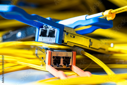 Gigabit Interface Converter, transceiver module connected to a fiber optic patch cord, telecommunications network components used in optical data transmission systems and IT infrastructure