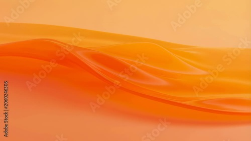 Soft flowing orange fabric creating a warm and inviting atmosphere. Ideal for backgrounds in creative projects and design applications