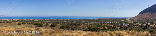 High-angle panoramic view of the Crete coastline from Mount Ederi overlooking Kato Gouves village and the Mediterranean Sea towards Heraklion, Greece