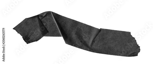 Fotografija Black masking tape strip with wrinkled texture, torn adhesive paper piece on whi