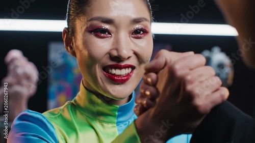 Determined Woman in Colorful Clothing Arm Wrestling with Intensity