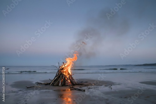 Bonfire on the beach at sunset