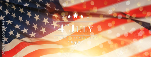 American Independence Day celebration banner featuring a waving USA flag, patriotic stars and stripes, glowing bokeh lights, and July 4th typography, for national holiday, freedom, patriotism themes.