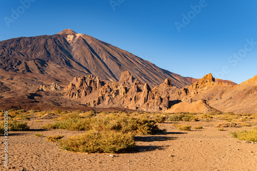 Majestic volcanic landscape of Teide National Park during golden hour, Spain.