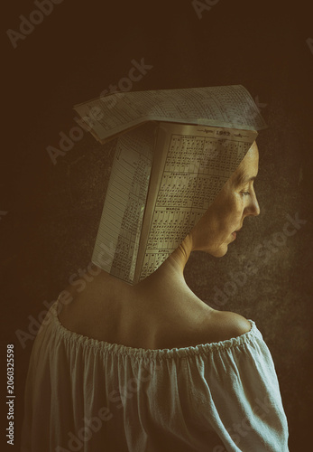artistic portrait of a woman with a paper hat made of calendars