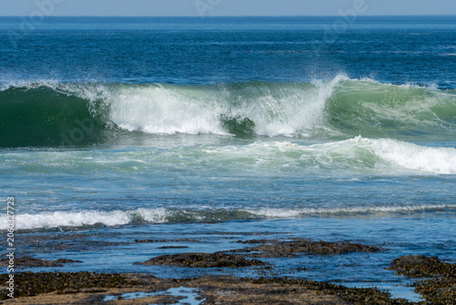 Surf Breaking Botanical Beach Shoreline. Botanical Beach rocky shelf shoreline in Juan de Fuca Provincial Park near Port Renfrew BC. 
