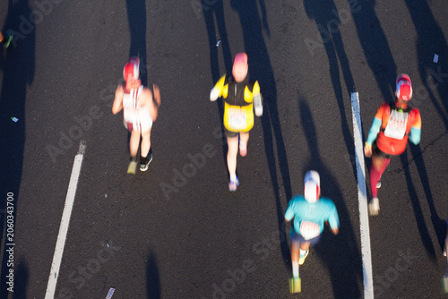 Marathon Runners in Motion Speed Blurs Overhead Action